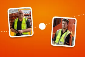 Two workers wearing safety vests in a warehouse setting